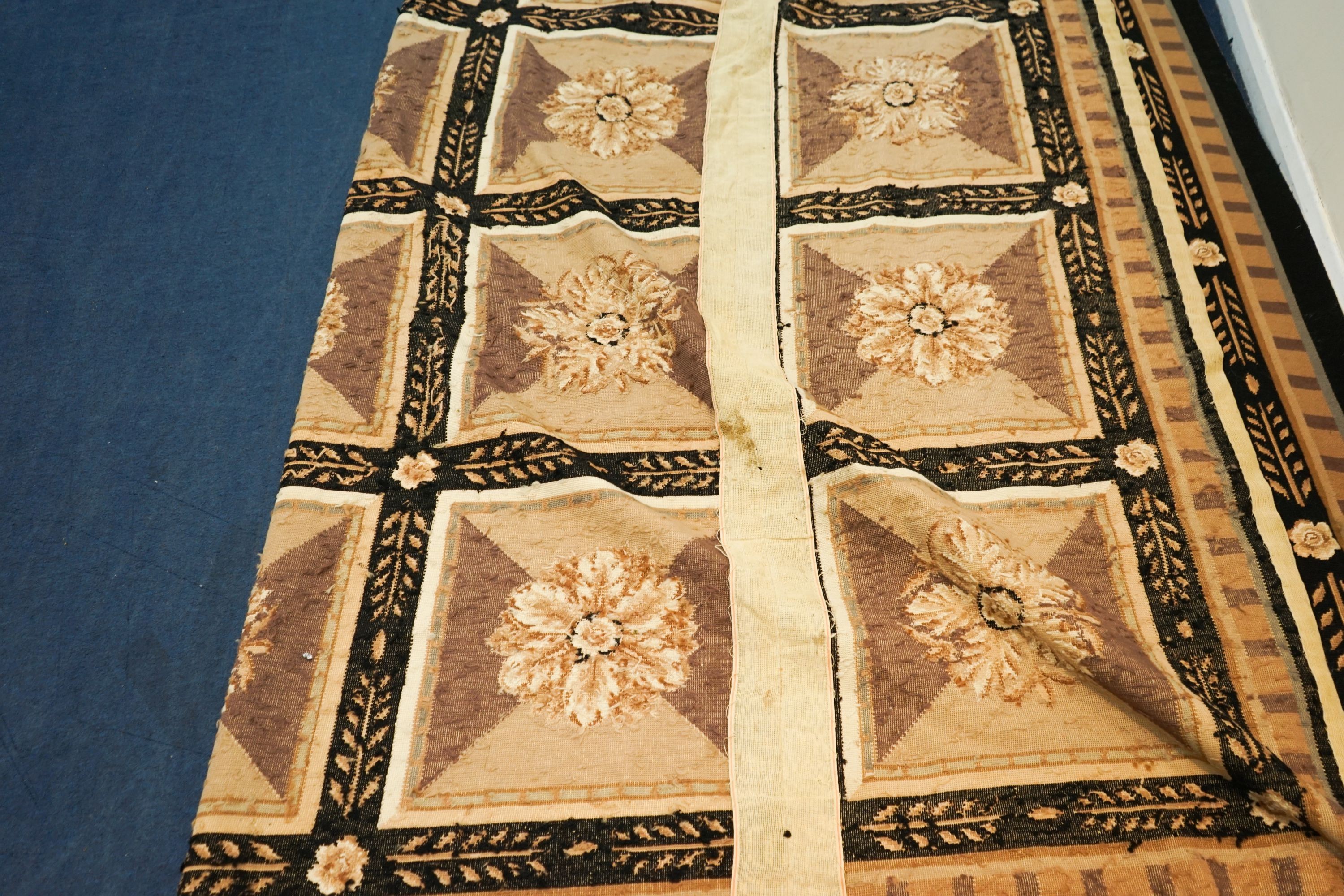 An Aubusson style floral tapestry carpet, 320 x 300cm